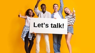 Teenagers holding a sign that says Lets Talk