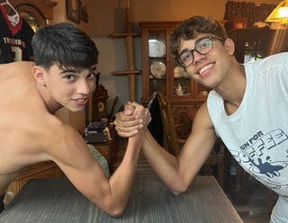 teen boys arm wrestling