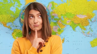 woman thinking with world map in background